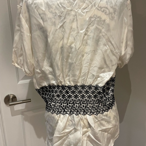 Beautiful silk blouse with black lace trim along the waist area. - Picture 7 of 10